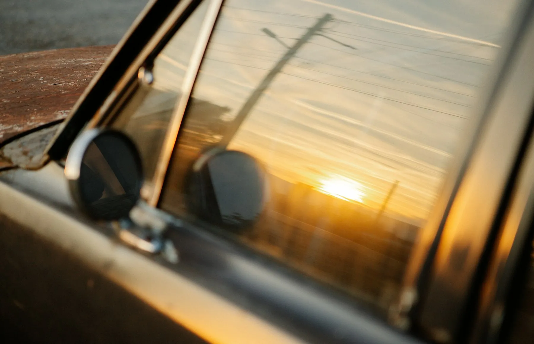 Low sun glaring through a car side window